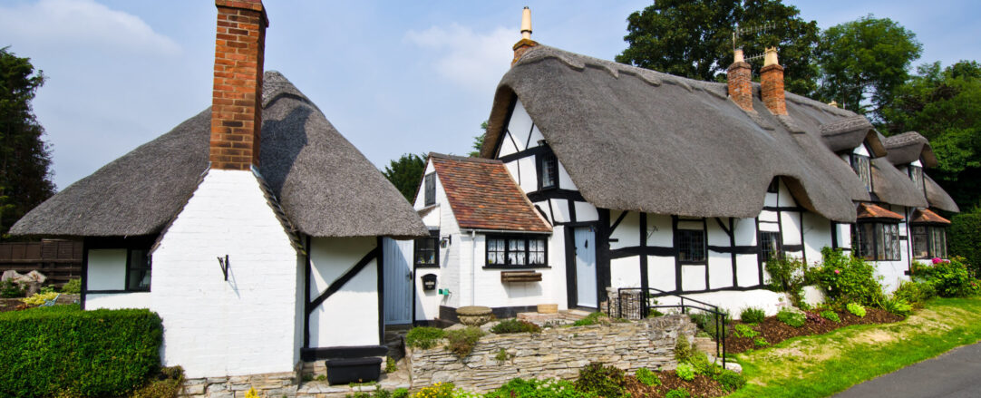 English Village Cottage Thatched roof house in the countryside